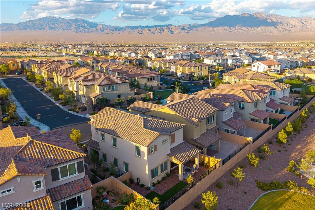 10583 Valletta Avenue, Las Vegas, NV 89166 Majestic mountain ridges provide a dramatic backdrop for this modern suburban neighborhood.