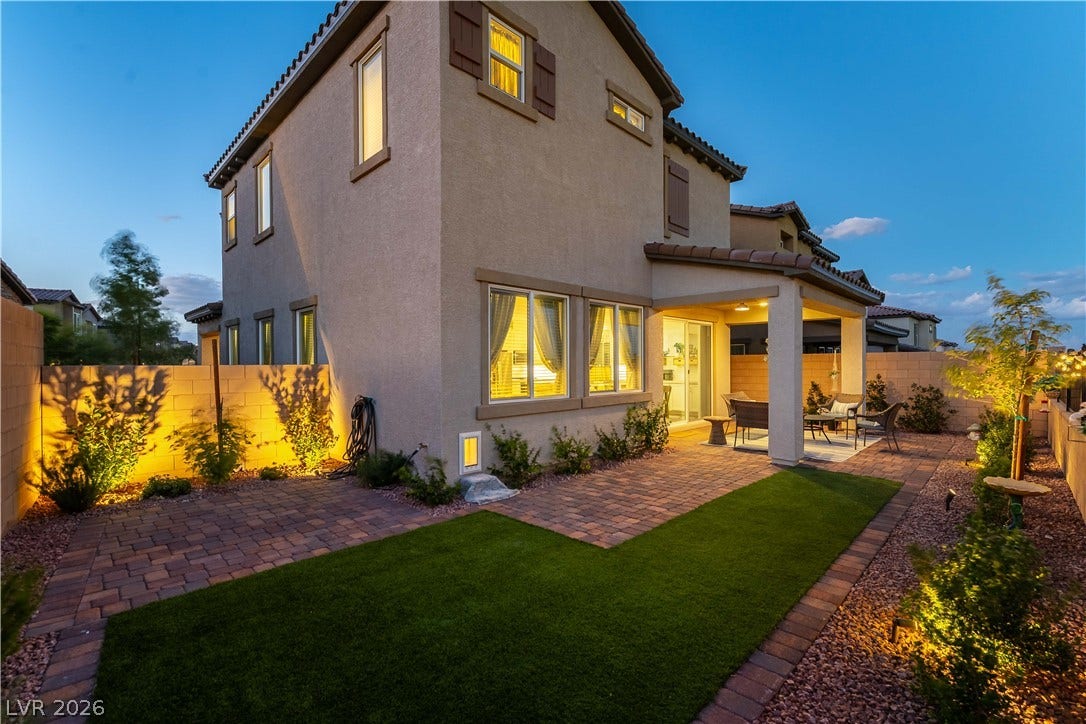 10583 Valletta Avenue, Las Vegas, NV 89166 A structured paver patio and pristine lawn define this tidy residential backyard retreat.