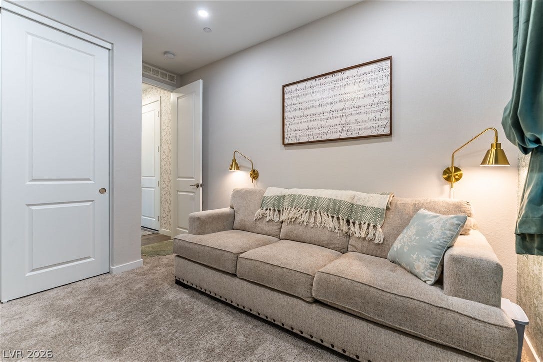 10583 Valletta Avenue, Las Vegas, NV 89166 Recessed lighting and plush carpeting design this versatile secondary living space.