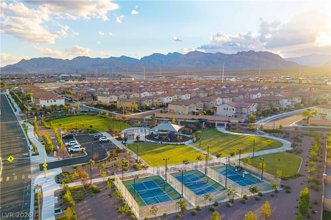 10583 Valletta Avenue, Las Vegas, NV 89166 Outstanding community amenities include modern sports courts and a sprawling park against a mountain backdrop.