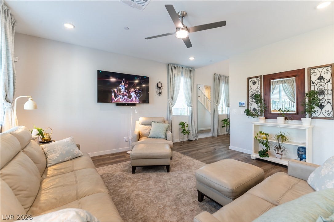 10583 Valletta Avenue, Las Vegas, NV 89166 Smooth wood flooring and clean architectural lines define this welcoming living space.