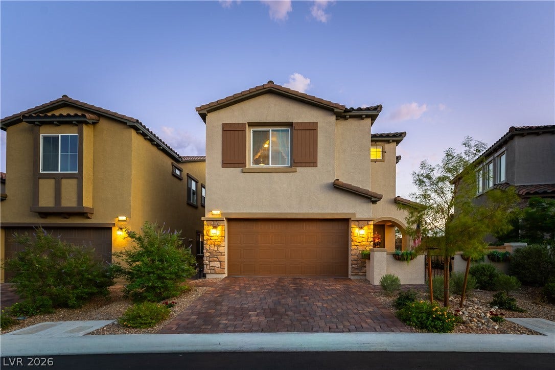 10583 Valletta Avenue, Las Vegas, NV 89166 Stone accents and a paved driveway enhance this contemporary two-story home.