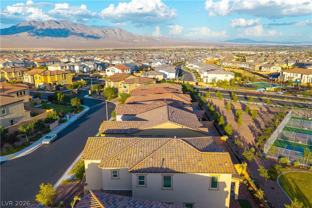 10583 Valletta Avenue, Las Vegas, NV 89166 Rugged mountains create a dramatic backdrop for this vibrant suburban neighborhood.