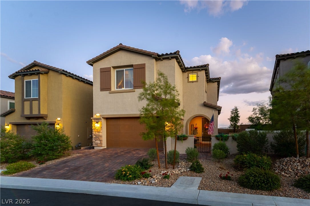 10583 Valletta Avenue, Las Vegas, NV 89166 Spanish tile roofing and stone accents define this charming multi-level residence.