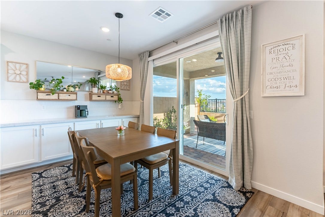 10583 Valletta Avenue, Las Vegas, NV 89166 Sliding glass doors connect the casual dining space directly to the covered back patio.