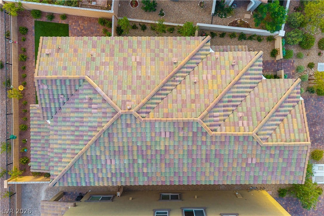 10583 Valletta Avenue, Las Vegas, NV 89166 An aerial perspective showcases the multi-toned tile roof design and structured property lot.