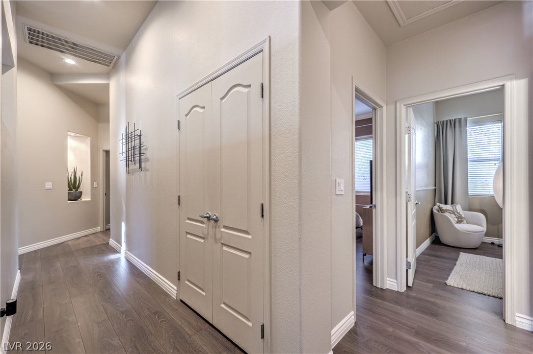 Gleaming hardwood floors and crisp crown molding flow throughout this welcoming entry hall.