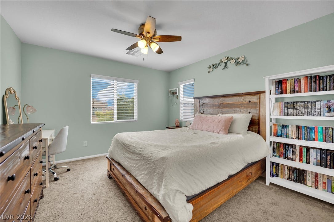 1421 Lamance Court, North Las Vegas, NV 89031 Soft carpet flooring and natural light from dual windows define this comfortable bedroom space.