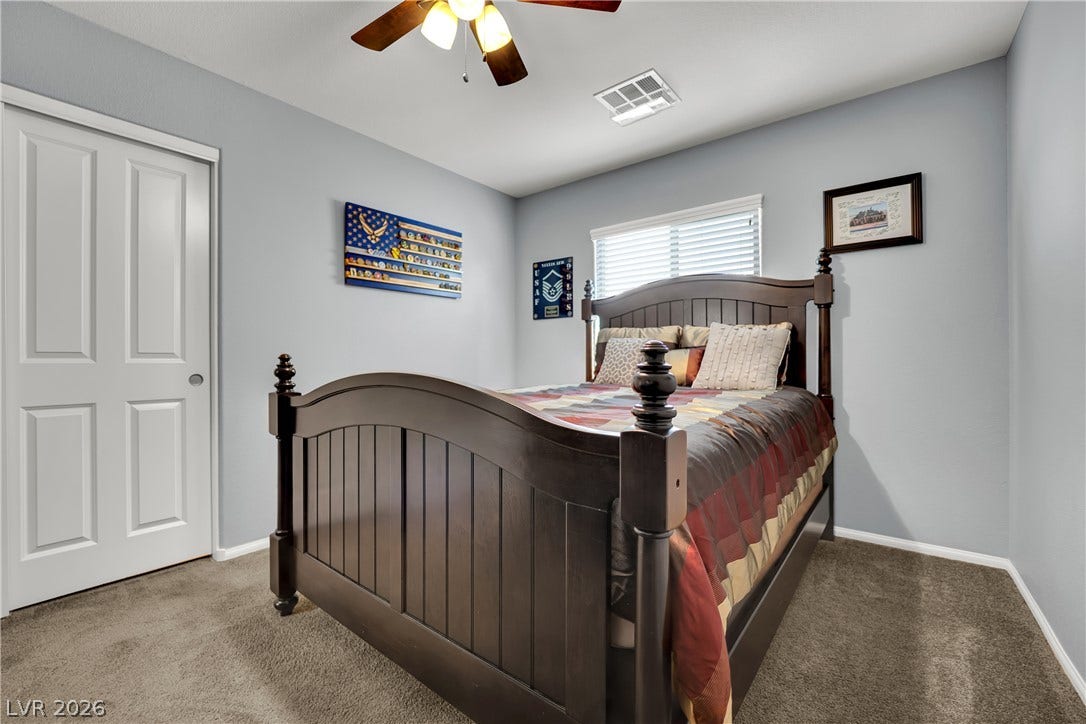 1421 Lamance Court, North Las Vegas, NV 89031 Plush wall-to-wall carpeting and neat baseboard moldings frame this comfortable sleeping space.
