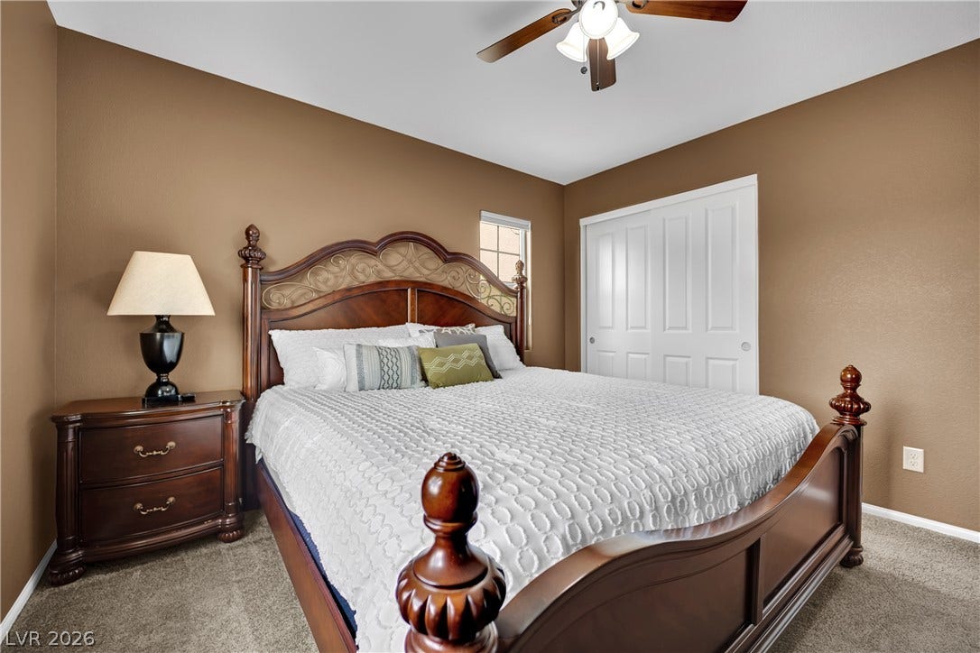 1421 Lamance Court, North Las Vegas, NV 89031 Warm earth tones and soft carpeting create a cozy, inviting atmosphere in this bedroom.