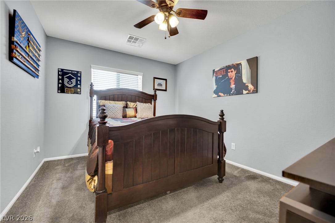 1421 Lamance Court, North Las Vegas, NV 89031 Plush wall-to-wall carpeting and clean architectural lines define this comfortable private bedroom.