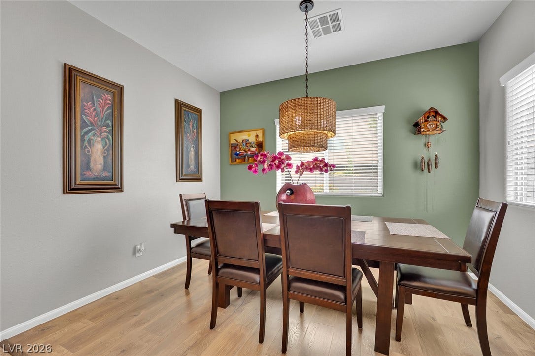 1421 Lamance Court, North Las Vegas, NV 89031 Smooth wood flooring and classic window details highlight this welcoming dining space.