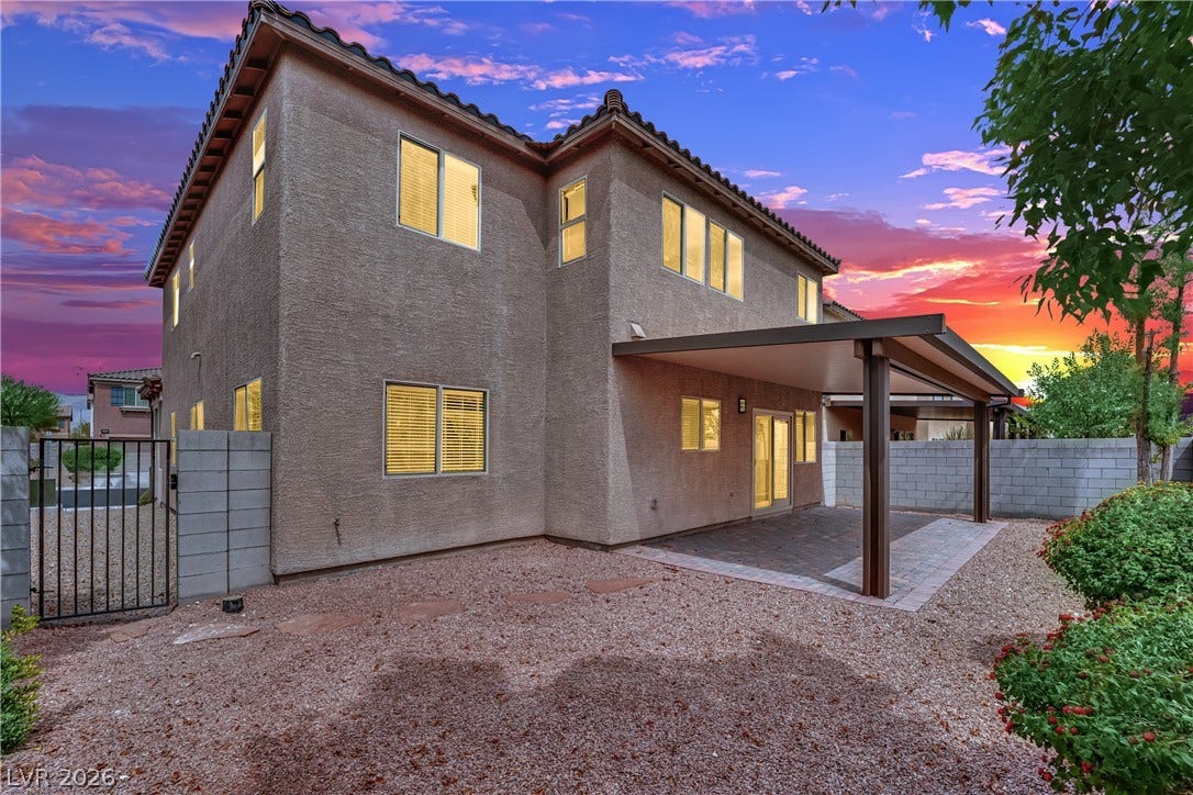 1421 Lamance Court, North Las Vegas, NV 89031 A spacious covered patio overlooks the low-maintenance desert yard of this stucco home.