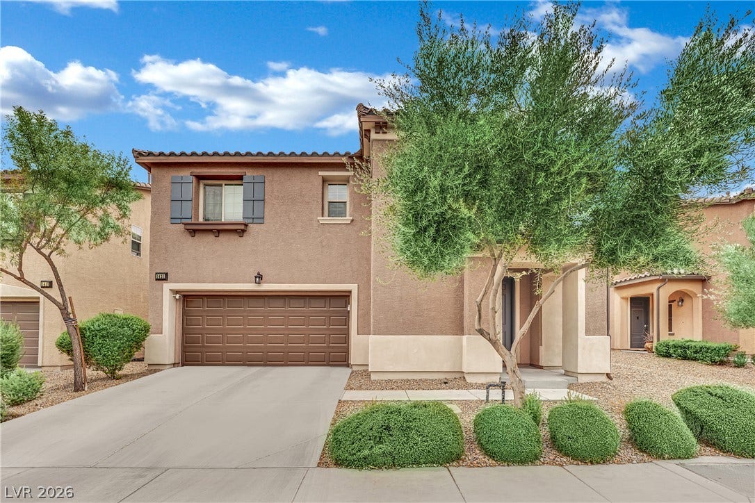 1421 Lamance Court, North Las Vegas, NV 89031 Mediterranean architectural details and neat desert plantings frame this dual-level residence.