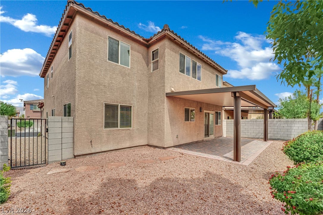 1421 Lamance Court, North Las Vegas, NV 89031 A spacious covered patio anchors this low-maintenance backyard under clear desert skies.