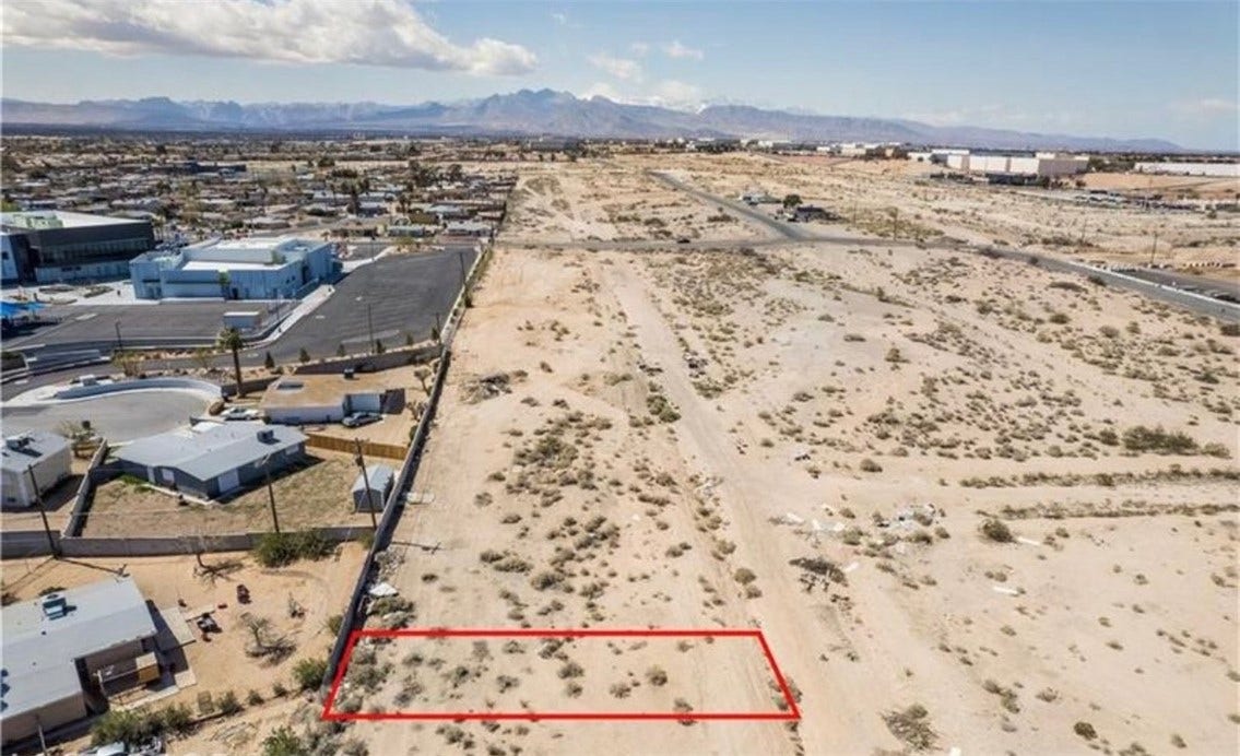 Commerce And Windsor, North Las Vegas, NV 89030 Distant mountains frame this desert parcel bordered by residential and commercial development.