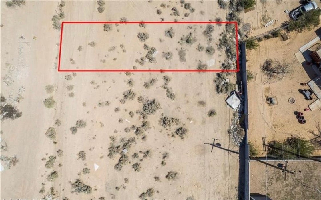 Commerce And Windsor, North Las Vegas, NV 89030 An aerial perspective outlines the level desert terrain of this spacious property lot.