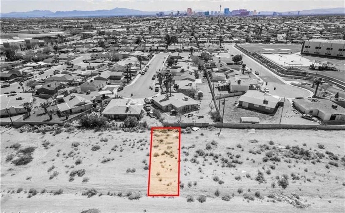 Commerce And Windsor, North Las Vegas, NV 89030 An aerial perspective captures this vacant parcel with distant mountain and city skyline views.