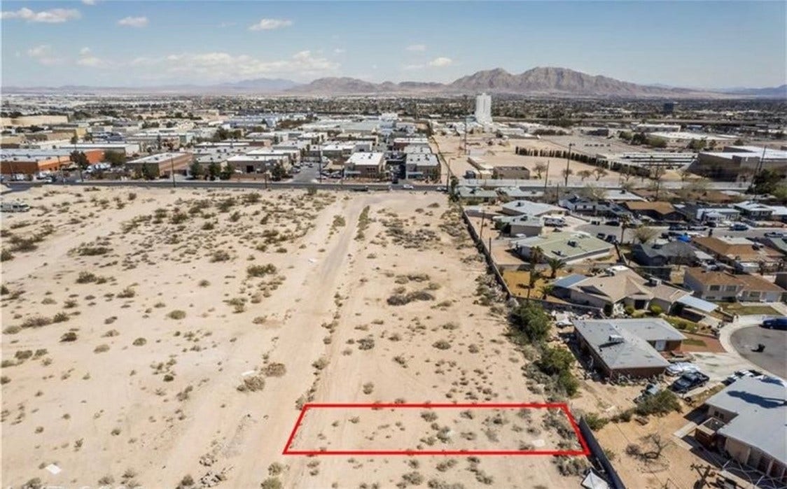 Commerce And Windsor, North Las Vegas, NV 89030 An aerial view highlights the expansive desert parcel set against a distant mountain backdrop.