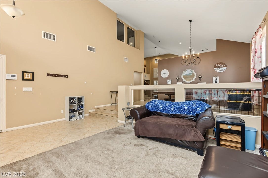 7021 Albatross Attic Street, North Las Vegas, NV 89084 High ceilings and multi-level design define this open-concept interior space.
