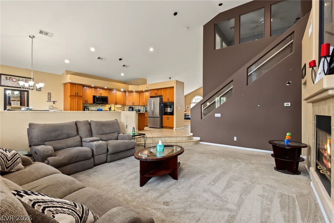 7021 Albatross Attic Street, North Las Vegas, NV 89084 Soaring ceilings and an open-concept flow anchor this comfortable living space.