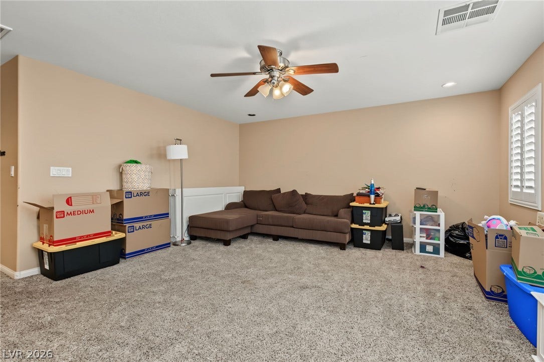 7021 Albatross Attic Street, North Las Vegas, NV 89084 Plush wall-to-wall carpeting and plantation shutters define this versatile living space.