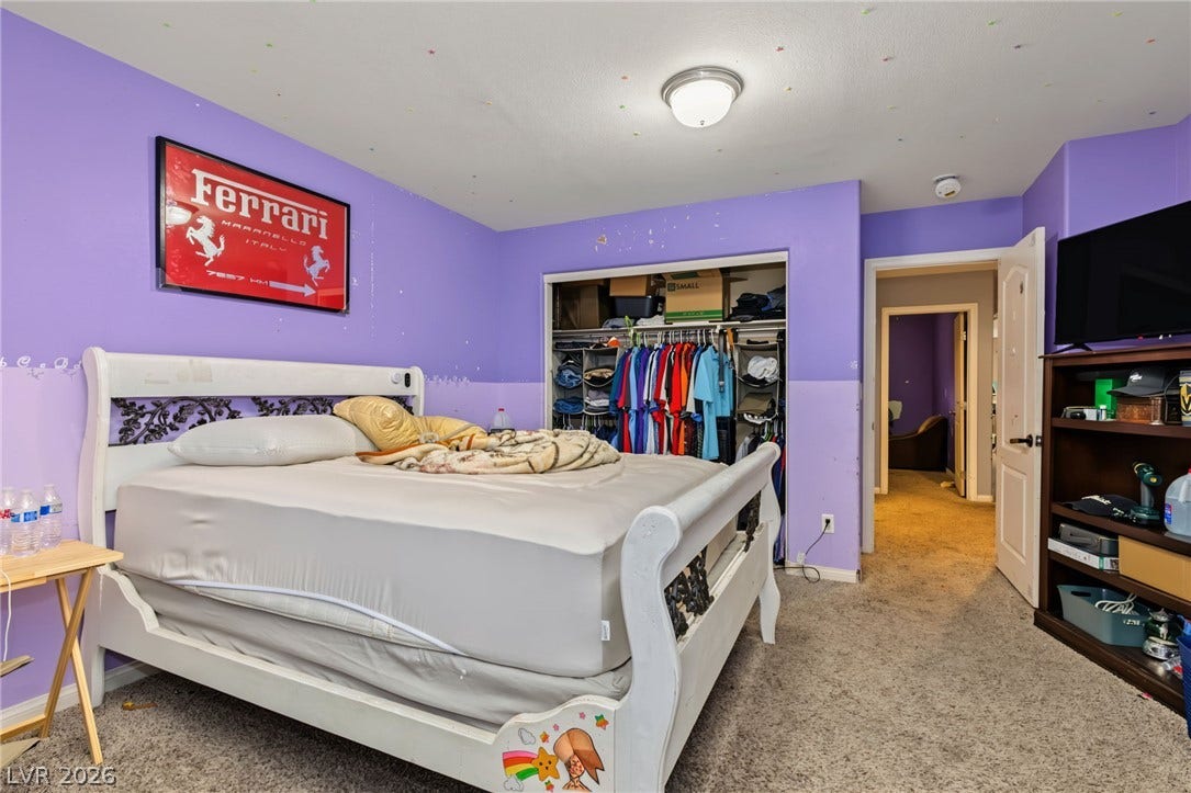 7021 Albatross Attic Street, North Las Vegas, NV 89084 A spacious bedroom features soft wall-to-wall carpeting and an open closet design.