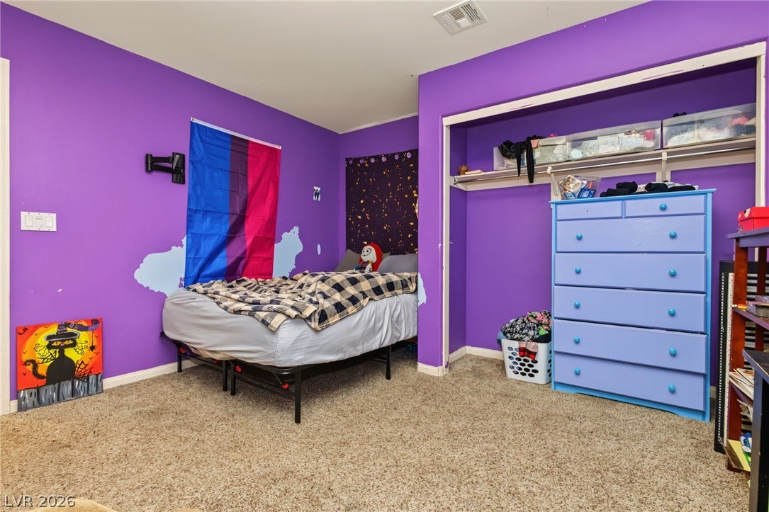 7021 Albatross Attic Street, North Las Vegas, NV 89084 Plush wall-to-wall carpeting and a wide closet define this private bedroom space.