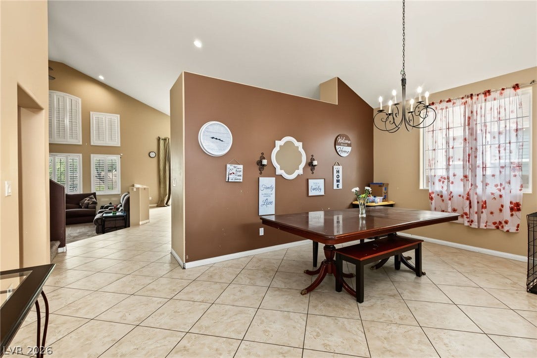 7021 Albatross Attic Street, North Las Vegas, NV 89084 Tiled floors and vaulted ceilings enhance this open-concept dining area.