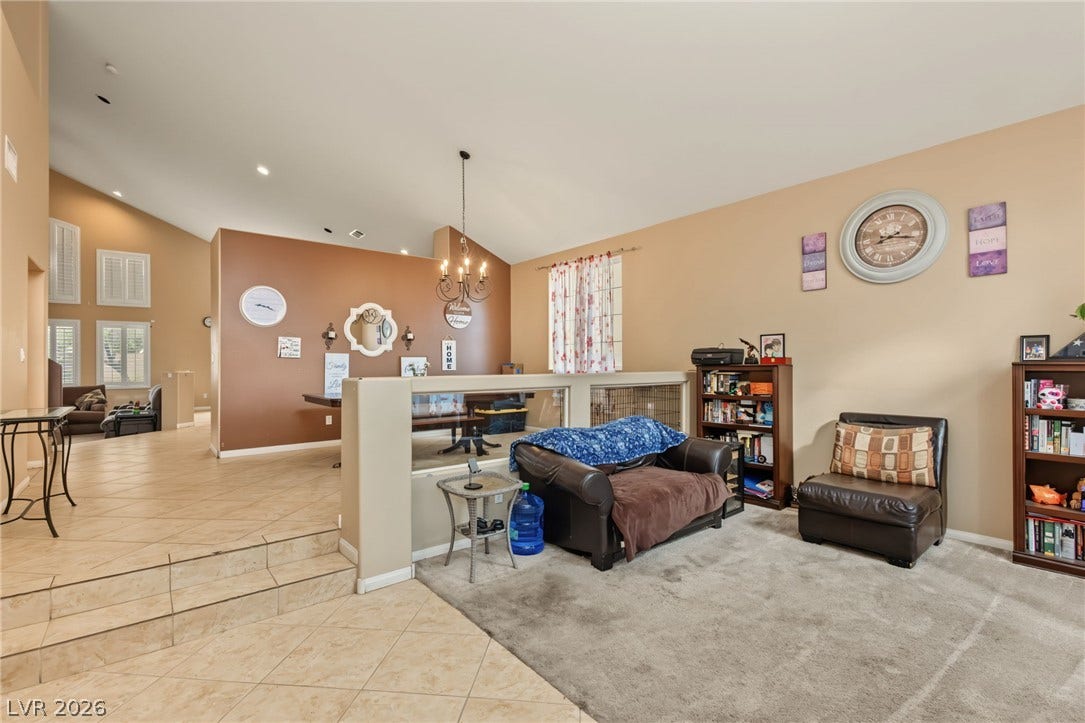 7021 Albatross Attic Street, North Las Vegas, NV 89084 Soaring vaulted ceilings and tile steps create an inviting split-level layout.