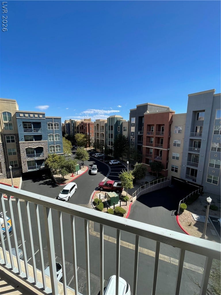 32 E Serene Avenue, #407, Las Vegas, NV 89123 An elevated perspective overlooks the paved courtyard and neighborhood below.