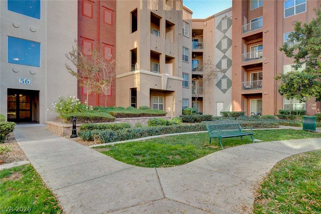 32 E Serene Avenue, #407, Las Vegas, NV 89123 Concrete walkways wind through manicured green space in this welcoming courtyard setting.