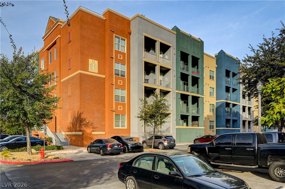 32 E Serene Avenue, #407, Las Vegas, NV 89123 Multi-colored exterior facades define this contemporary multi-level residential building.