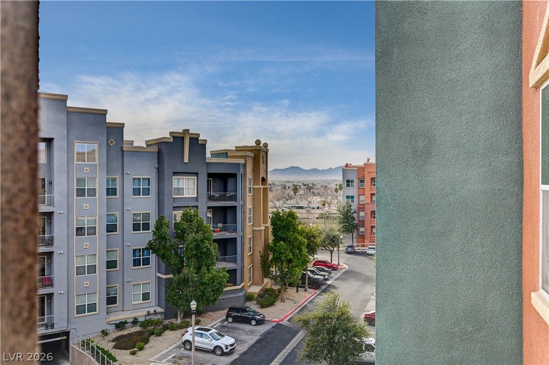 32 E Serene Avenue, #407, Las Vegas, NV 89123 Distant mountain views frame the surrounding neighborhood from this elevated vantage point.