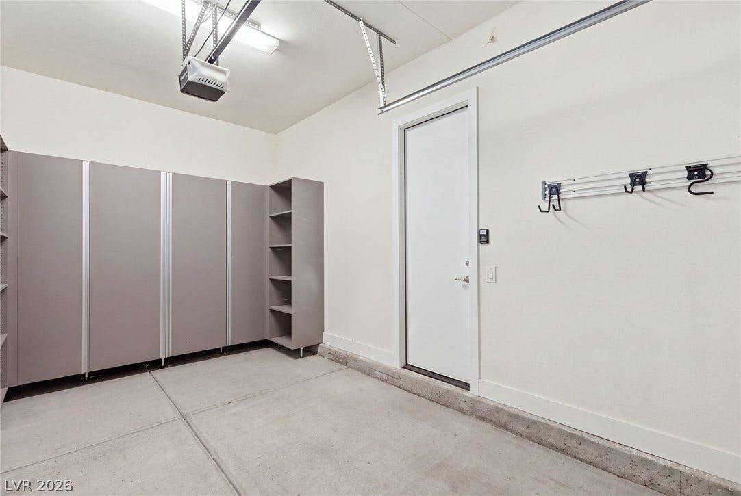 A well-organized garage offers extensive built-in storage solutions and convenient internal access.