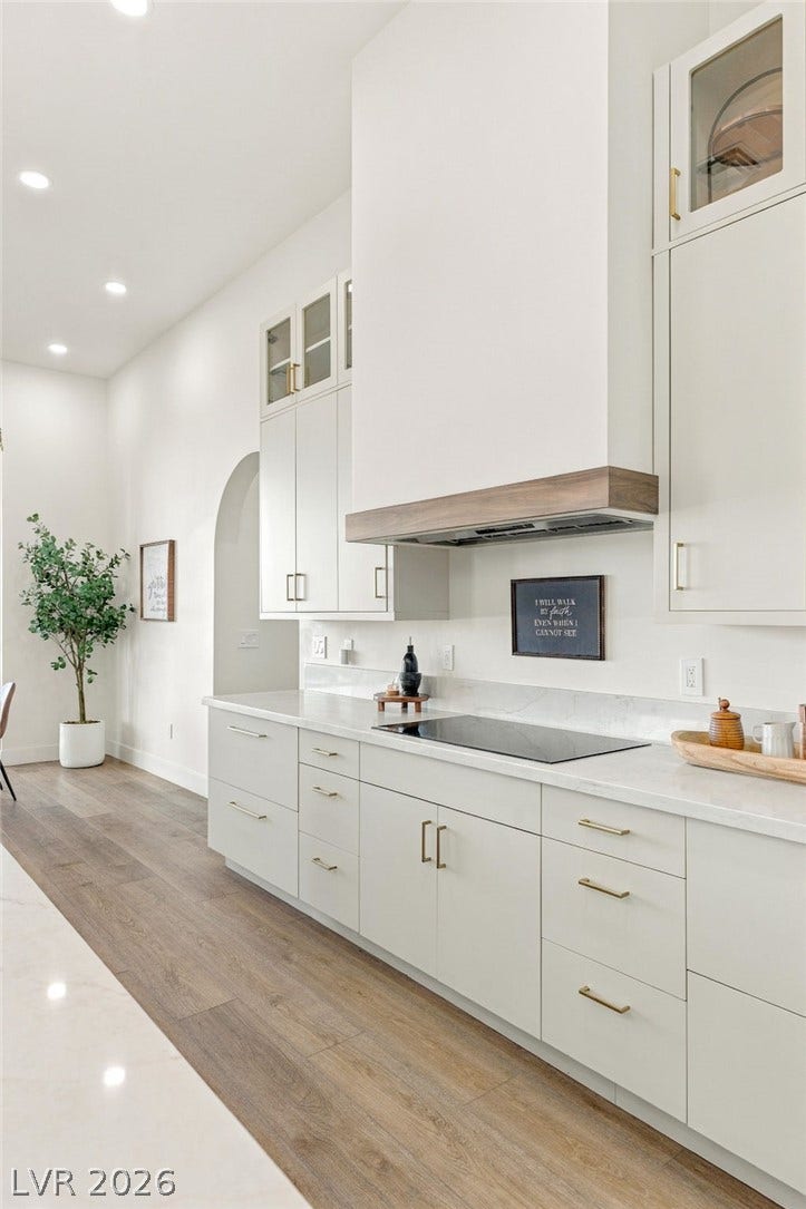 324 Wanda Road, Henderson, NV 89002 Gleaming stone countertops and sleek modern cabinetry anchor this beautifully designed kitchen.