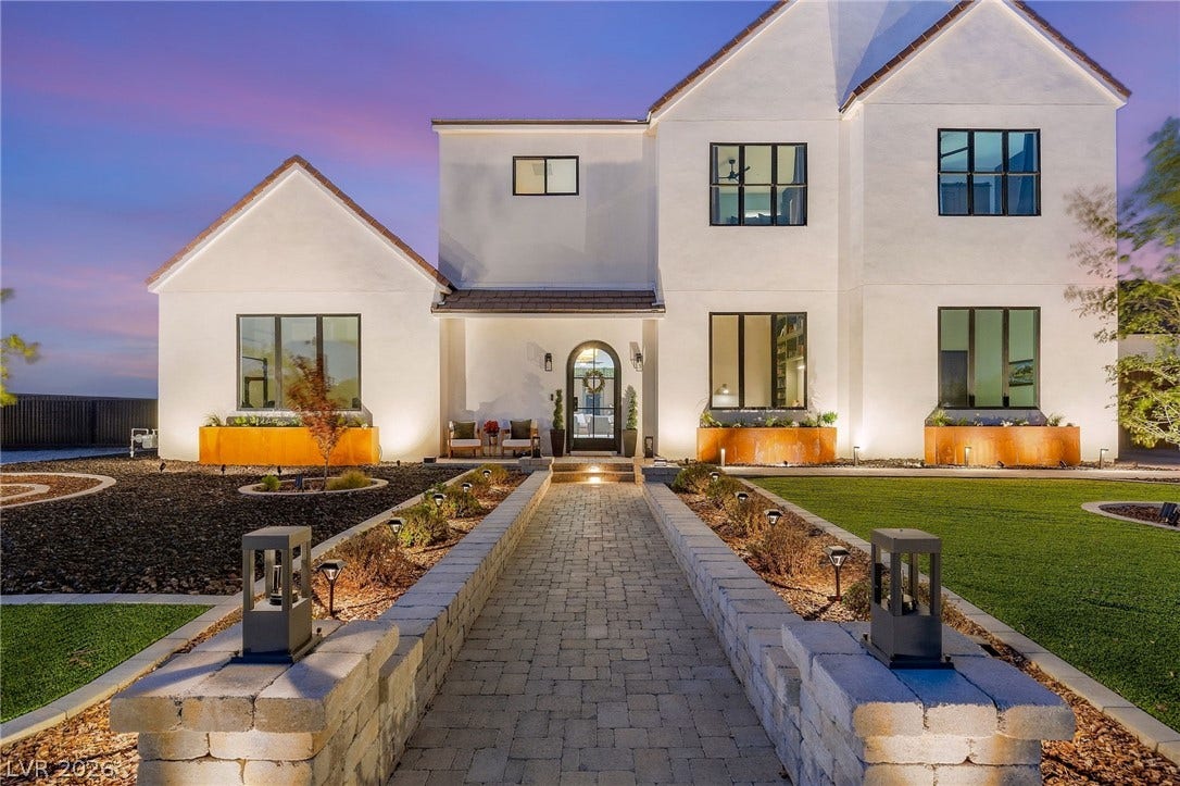 324 Wanda Road, Henderson, NV 89002 An inviting stone walkway leads directly to the arched glass entrance of this modern home.