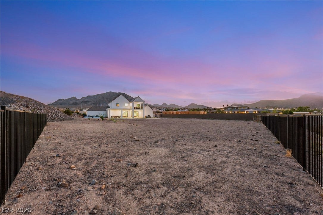 324 Wanda Road, Henderson, NV 89002 A spacious, fenced lot offers ample room for outdoor expansion against a mountain backdrop.