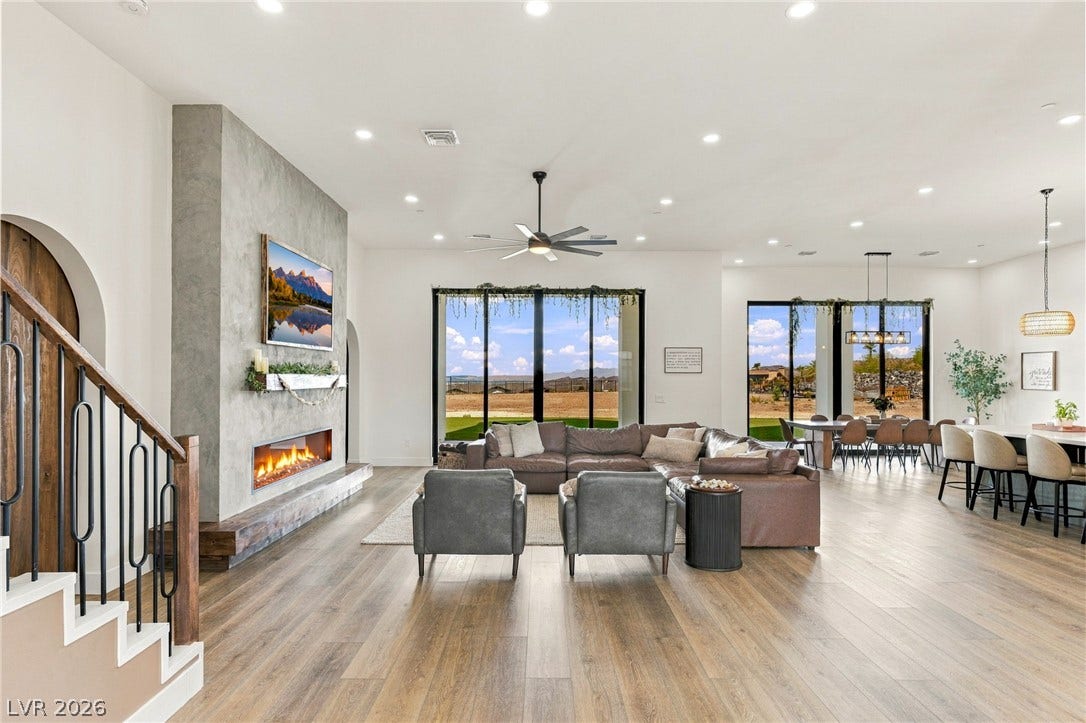324 Wanda Road, Henderson, NV 89002 A modern linear fireplace anchors the airy, open-concept living space with wide-plank wood flooring.