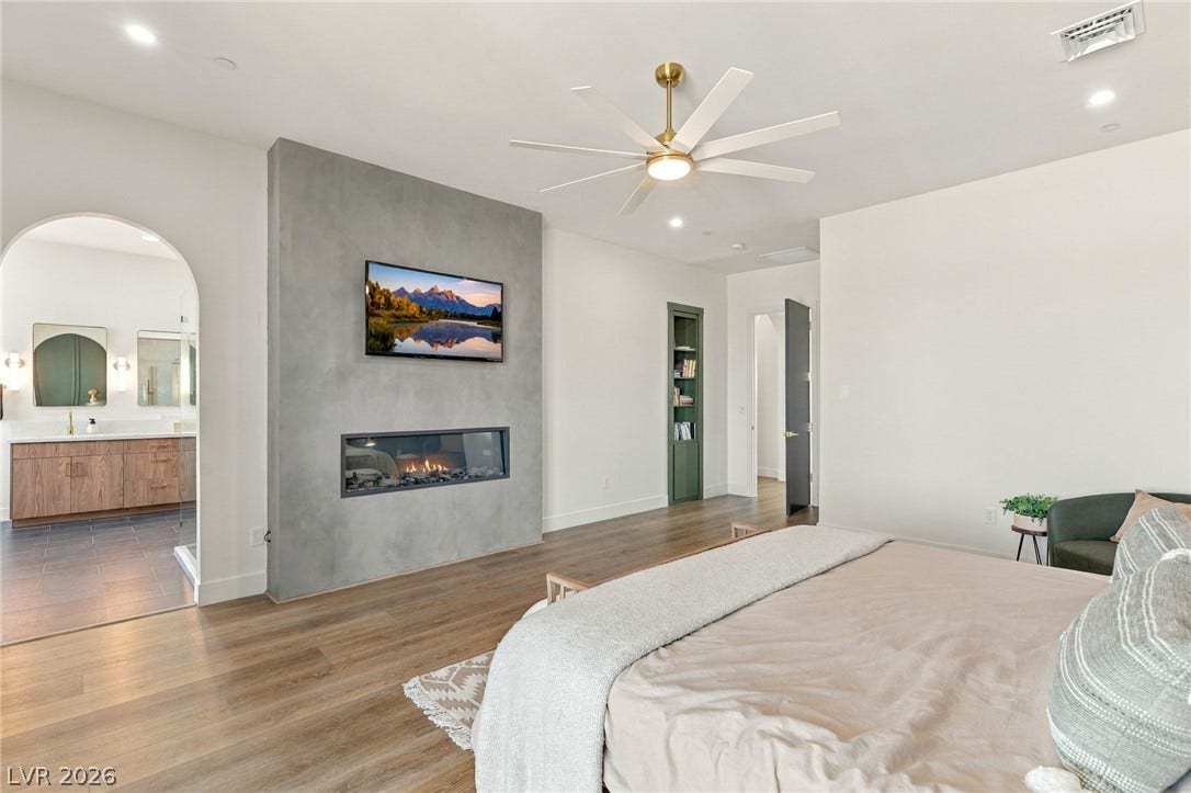324 Wanda Road, Henderson, NV 89002 An elegant fireplace anchors the sleeping quarters, leading seamlessly into an attached bath.