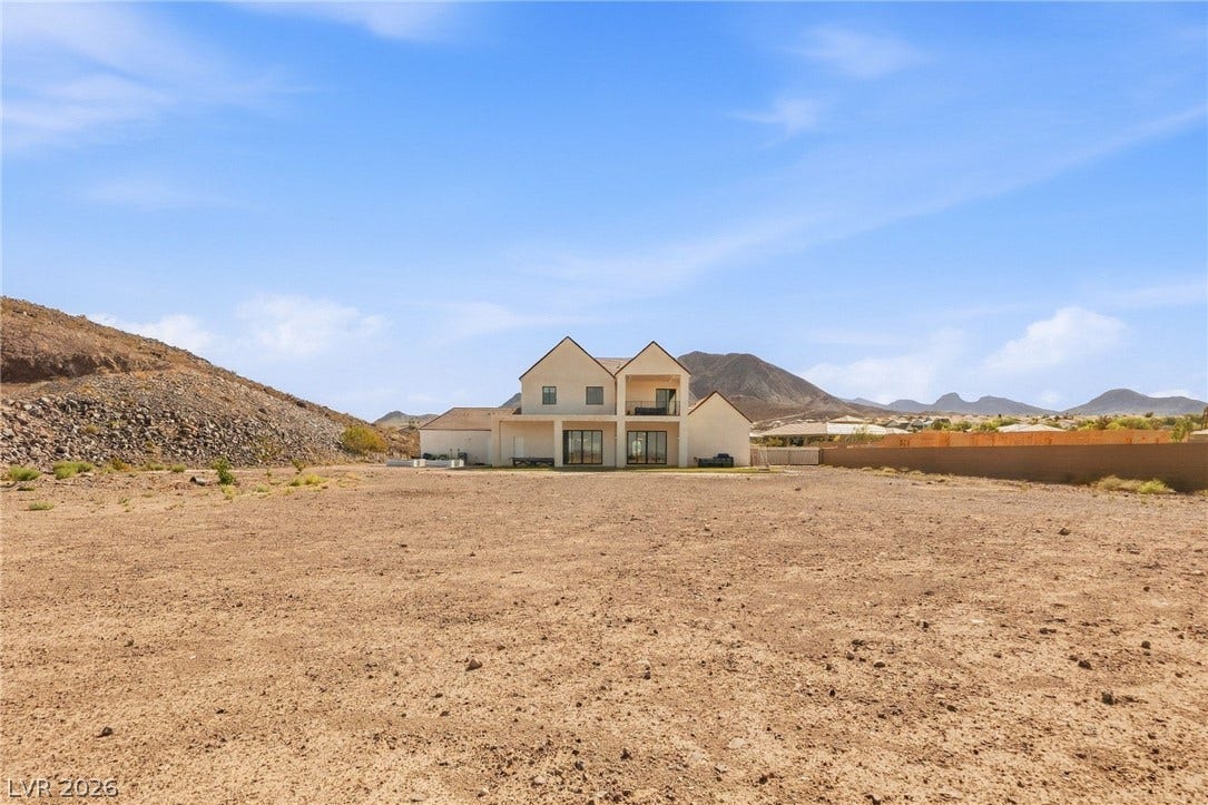 324 Wanda Road, Henderson, NV 89002 A spacious desert acreage sits ready for custom development against a dramatic mountain backdrop.