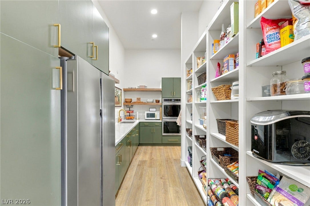 324 Wanda Road, Henderson, NV 89002 Ample built-in shelving pairs with sleek modern cabinetry and durable wood flooring.