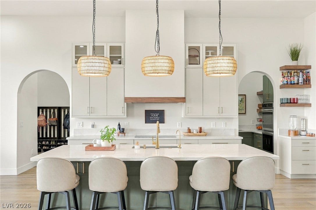 324 Wanda Road, Henderson, NV 89002 An oversized center island anchors this open kitchen with elegant arched transitions.