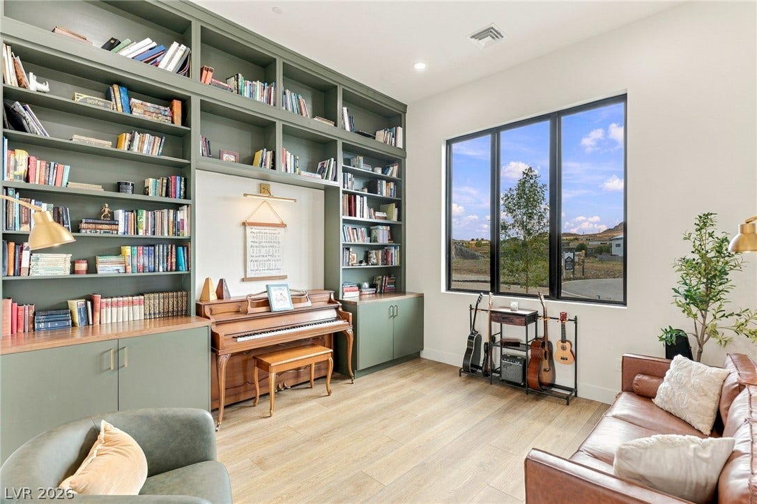 324 Wanda Road, Henderson, NV 89002 Massive floor-to-ceiling built-in bookcases and expansive picture windows define this versatile study.