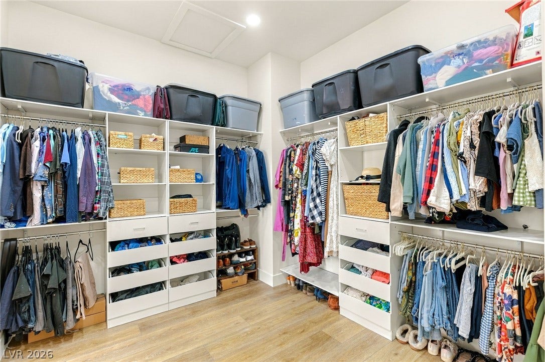 324 Wanda Road, Henderson, NV 89002 Ample built-in shelving and custom hanging rods maximize storage within this wood-floored dressing area.