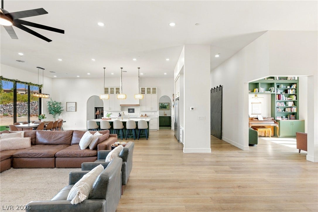 324 Wanda Road, Henderson, NV 89002 An open floor plan seamlessly connects the kitchen and living areas over handsome wood flooring.