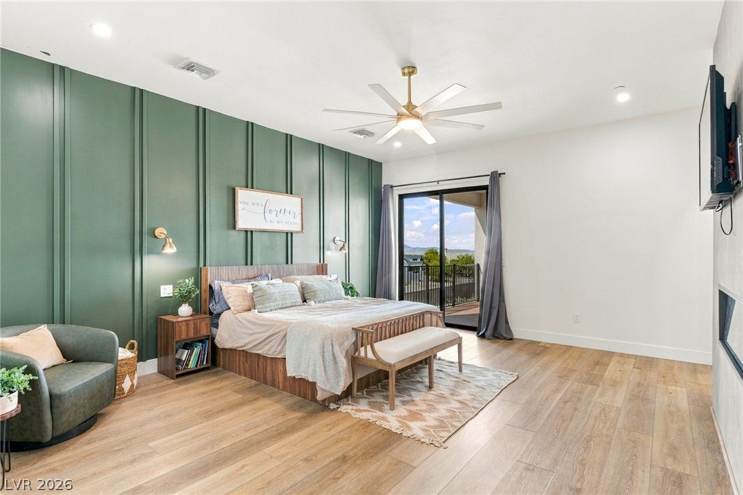 324 Wanda Road, Henderson, NV 89002 A glass sliding door opens to a private balcony from this spacious bedroom.