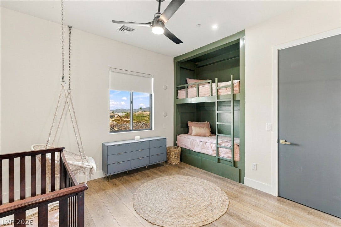 324 Wanda Road, Henderson, NV 89002 Smooth wood floors and unique built-in bunk beds highlight this versatile secondary bedroom.