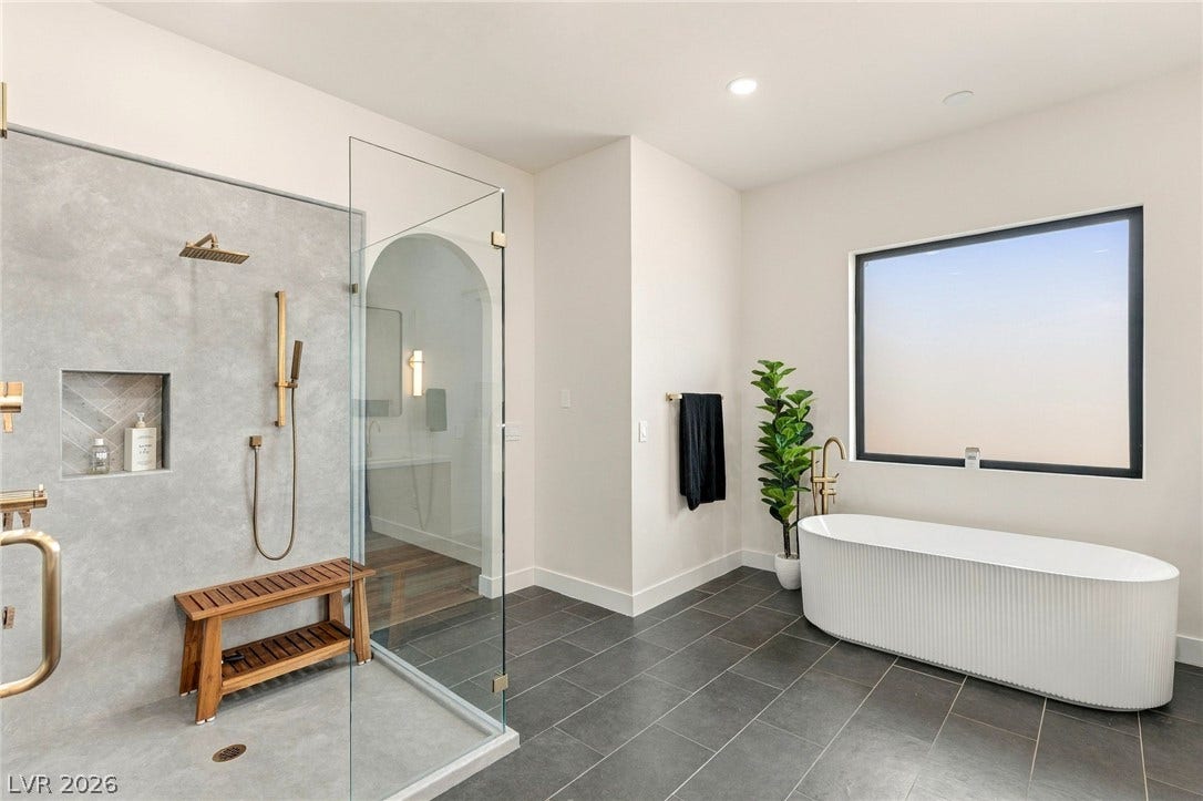 324 Wanda Road, Henderson, NV 89002 A freestanding tub and walk-in shower elevate this contemporary bathroom.