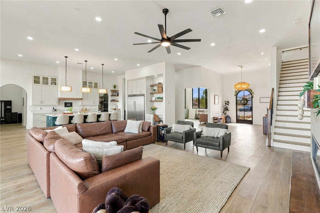 324 Wanda Road, Henderson, NV 89002 An open main level showcases hardwood floors, high ceilings, and a seamless floorplan flow.